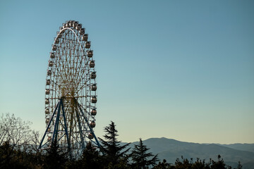 View of the Ferris wheel in Mtatsminda park, Georgia, Tbilisi.
