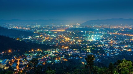 Obraz premium aerial view City night from the view point on top of mountain, Chiang mai,Thailand