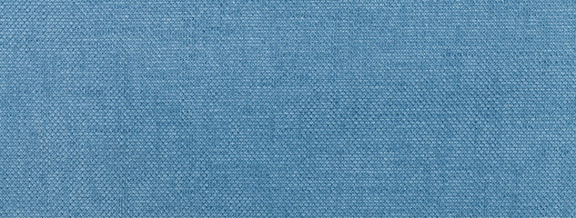 Texture of light blue color background from textile material with wicker pattern, macro. Vintage denim fabric