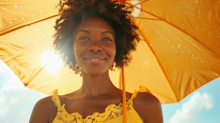 Happy black afro american woman with sunny blue sky holding a yellow umbrella or sunshade to protect her skin from sun light with return of warm days - Powered by Adobe