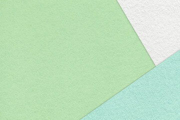 Texture of craft light green color paper background with white and cyan border. Vintage abstract olive cardboard.