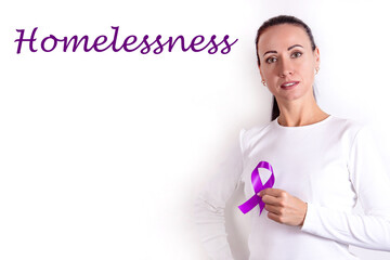 A woman in a white clothing with a purple ribbon in her hand as a sign of Homelessness awareness.