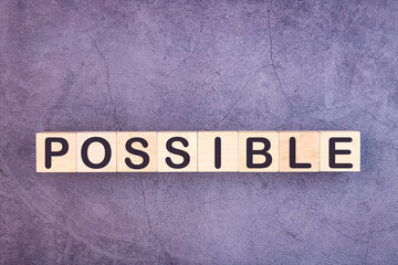 POSSIBLE word made with wood building blocks.