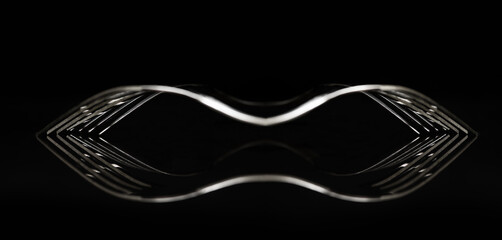 Abstract reflection of two silver forks against a black background