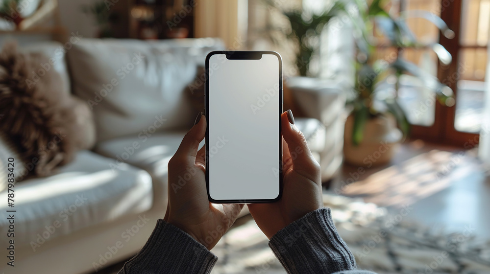Poster mock-up a top-down view of a persons hands holding a smartphone with a blank screen. smartphone user