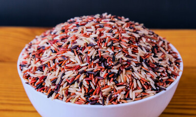 Close up front view photo of riceberry on white bowl
