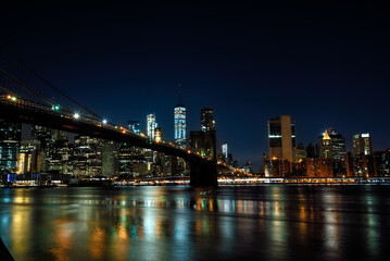 The Brooklyn Bridge and Manhattan Financial District seen from Brooklyn Bridge Park at Night - New...