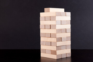 Blocks of wood on a dark background, Strategy game as a business plan for teamwork