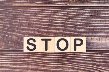 STOP word made with wood building blocks