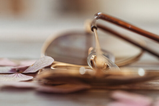 Close-up of a pair of gold rimed aviator style sunglasses