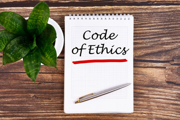 Code of Ethics - handwriting on a notebook with pen