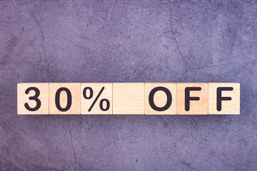 30 percent off text made with wood building blocks.