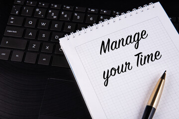 Manage your time.  Your Marketing Strategy - written on a notebook with a pen.