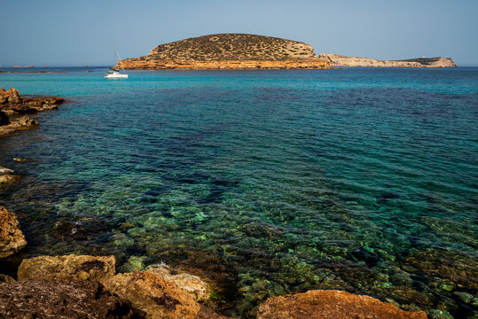 Catamaran anchored at Cala Comte beach, Sant Josep de Sa Talaia, Ibiza, Balearic Islands, Spain