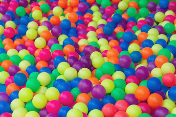 Many colorful plastic balls for children's play