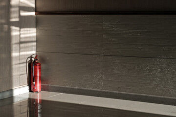 old fire extinguisher put on the conner of the meeting room in the sunshine from out side