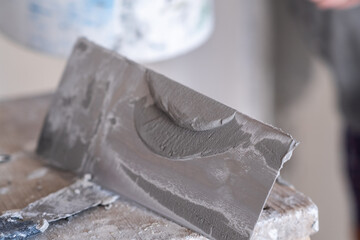 Applying decorative putty. White abstract texture of surface covered with putty. textured...