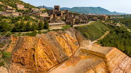 Aerial view of the former Monteponi mine, near Iglesias in Sardinia, Italy. The red color is due to...