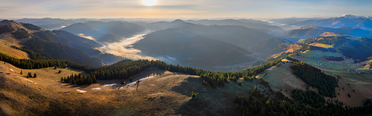 Panorama view on the top of the Carpathian Mountains in Romania. Early morning with fog in the valley in the Carpathian Mountains in Romania. Tibau valley in Carpathian, Carlibaba, Suceava, Romania. - obrazy, fototapety, plakaty