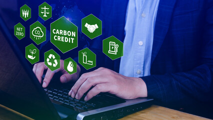Green energy, Carbon credit market concept, Businessman holding Carbon credit icon, Net zero, Green...