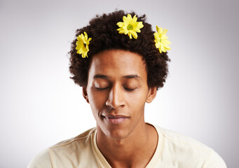 Eyes closed, afro and black man with hair or flowers, plant and petal decoration or happy isolated...