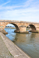 Skopje, Macedonia- March 31, 2024: Stone bridge Skopje, a bridge across the Vardar River in Skopje,...
