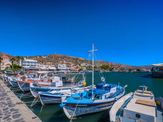 Obraz premium Boats mooring in a marina (Elounda, Crete, Greece)