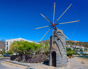 Windmill in a beachside (Elounda, Crete, Greece) - obrazy, fototapety, plakaty