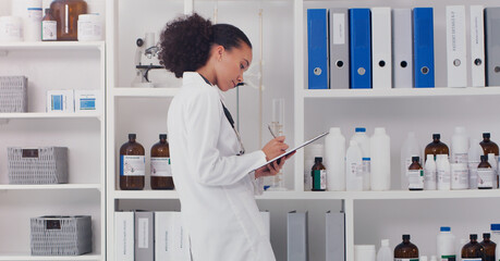 Woman, scientist and clipboard for inventory in lab stock room for equipment check and analyse products. Female pharmacist, checklist and bottles chemical supply in laboratory for research and work. - obrazy, fototapety, plakaty