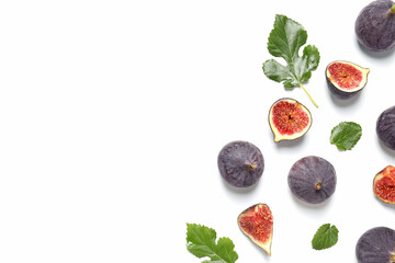 Fresh ripe figs with leaves on a white background