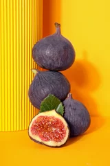  Fresh ripe figs on a yellow background © Atlas