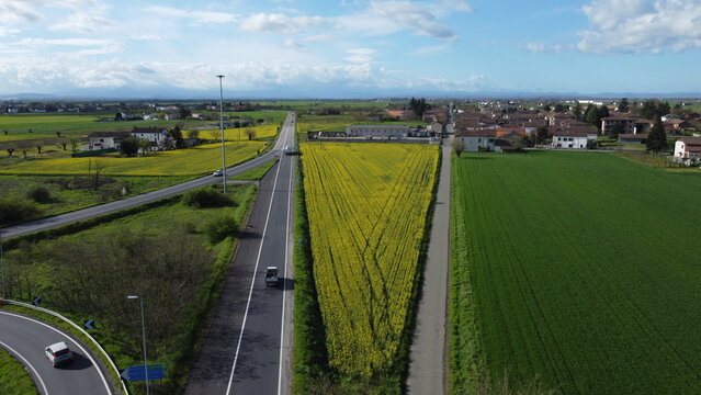 Aerial view of cars driving along rural roads, Spinetta Marengo, Alessandria, Piedmont, Italy