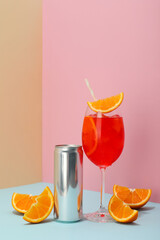 Cocktail with fresh oranges on a blue background