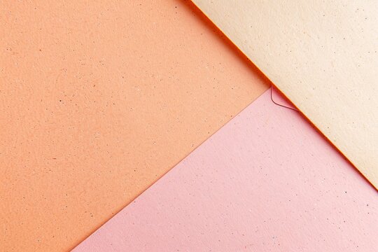 Light pink and orange ombre on recyclable cardboard with blank space
