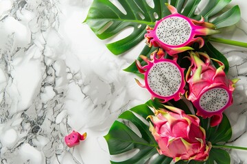 Unique flat composition featuring organic pink dragon fruit on marble surface Stylish overhead view...
