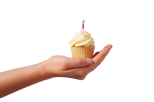 Woman's hand holding a cupcake with a lighted candle isolated on a cutout PNG transparent background