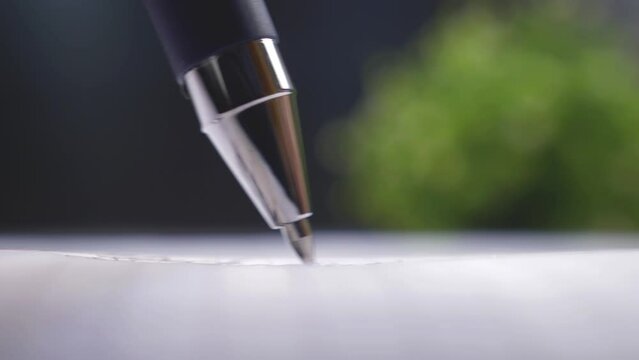 Business person signing contract. Ballpoint pen close up