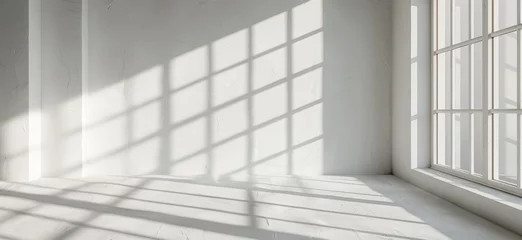 Deurstickers Abstract shadow patterns on a white wall in a minimalist room © Robert Kneschke