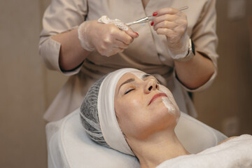 Applying a face mask in a beauty salon	
