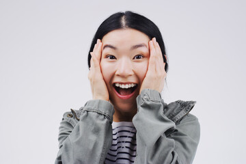 Studio background, surprise and asian woman in portrait with mockup space, wow and mind blown with good news. Happy, female person and omg reaction for announcement, lottery or competition prize - obrazy, fototapety, plakaty