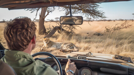 Tourist Photographing Cheetah on Safari