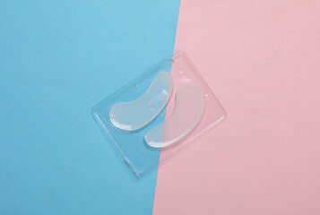 Eye patches on a blue-pink background. Beauty concept