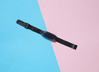 Modern smart bracelet on a blue-pink background