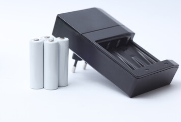 Charger with aa batteries on a white background