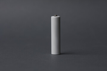 AAA battery on a dark gray background. Mockup for design