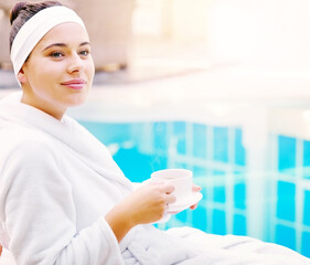 Relax, spa and woman in robe at pool with coffee, smile and hotel vacation for self care. Thinking, terrace and happy girl at luxury resort for wellness, health and massage at villa on travel holiday