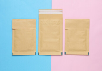 Shipping Post Parcel Envelopes on Pink Blue Background