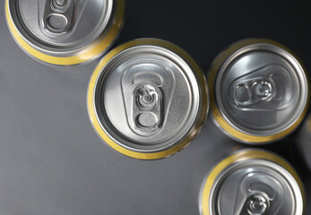 Aluminum cans for beer, soda or energy drink on dark gray background. Top view