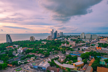 Aerial view of Pattaya city with clouds. Cityscape of Pattaya city, Thailand. Image contain of noise and dust. Select focus. - obrazy, fototapety, plakaty