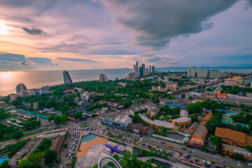 Aerial view of Pattaya city with clouds. Cityscape of Pattaya city, Thailand. Image contain of noise and dust. Select focus.